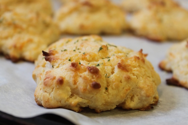 These cheddar garlic biscuits are the perfect accompaniment to almost any meal. They are fast and easy to make, and include no pre-made ingredients.