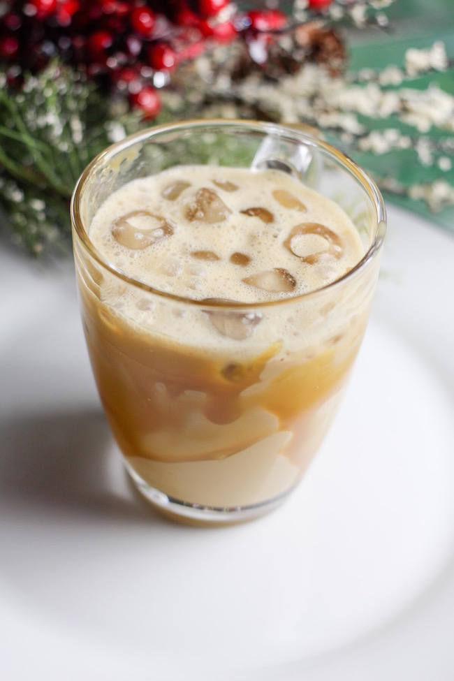 Dirty chai in glass with ice cubes