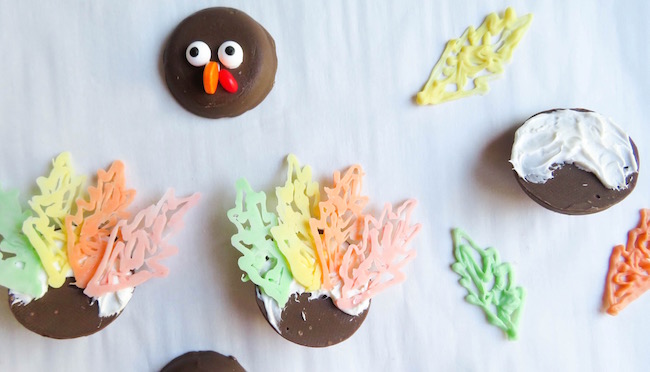 How to attach the feathers to the back of the cookies