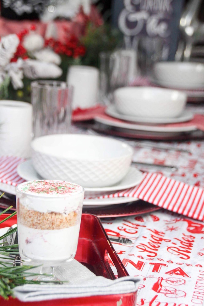 Cranberry dessert recipe with cool whip on our red and white Christmas table settings.