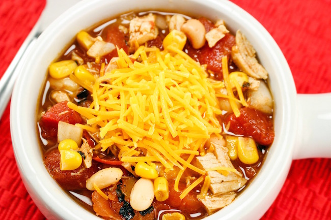 The Crockpot Chicken Chili recipe great to pop in the slow cooker in the morning before you leave for work or even the night before and start it up.