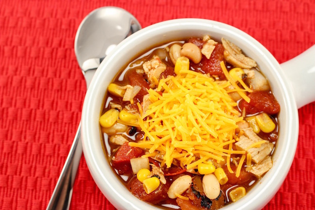 The Crockpot Chicken Chili recipe great to pop in the slow cooker in the morning before you leave for work or even the night before and start it up.
