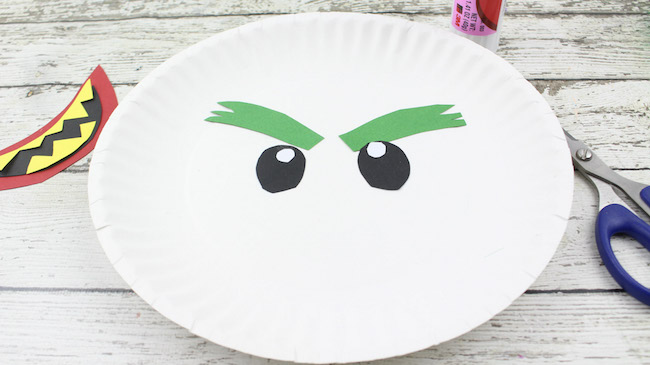 The Joker Paper Plate Craft Tutorial is my favorite. I don't know if it's the hair or what but it is definitely the most fun looking. 