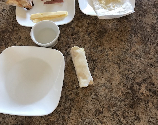 Air Fryer Reuben Egg Rolls recipe for St. Patrick's Day is filled with Corned Beef, Melted Swiss Cheese, Sauerkraut and dipped in 1000 Island dressing.