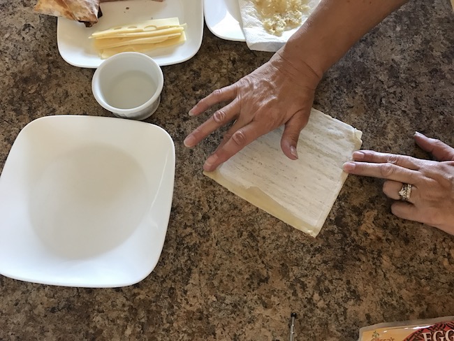 Air Fryer Reuben Egg Rolls recipe for St. Patrick's Day is filled with Corned Beef, Melted Swiss Cheese, Sauerkraut and dipped in 1000 Island dressing.