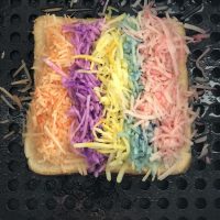 In honor of National Find A Rainbow Day and National Grilled Cheese Month, we made an Air Fryer Grilled Cheese Rainbow Sandwich recipe.