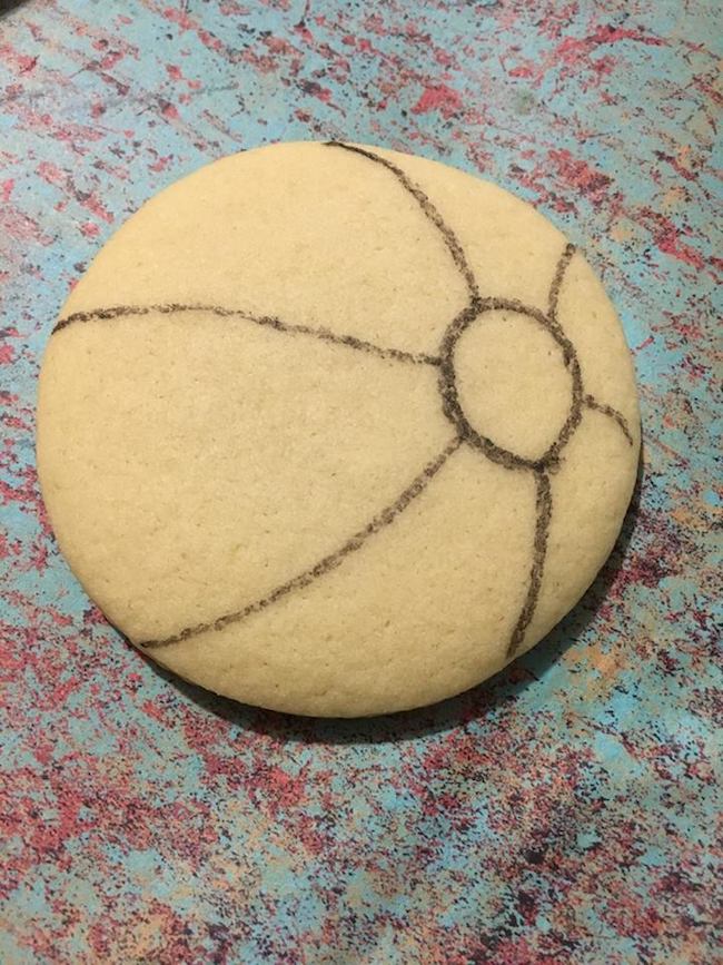 Drawing beach ball on cookie