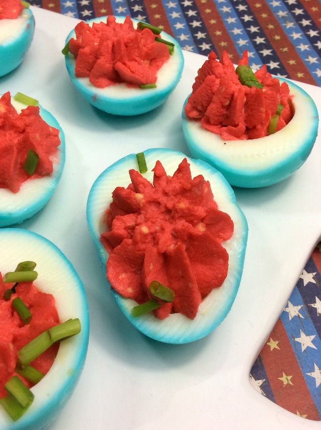 Who doesn't love deviled eggs? This year we are making them for our Memorial Day party with a twist, red, white, & blue Patriotic Deviled Eggs recipe.