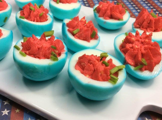 Who doesn't love deviled eggs? This year we are making them for our Memorial Day party with a twist, red, white, & blue Patriotic Deviled Eggs recipe.