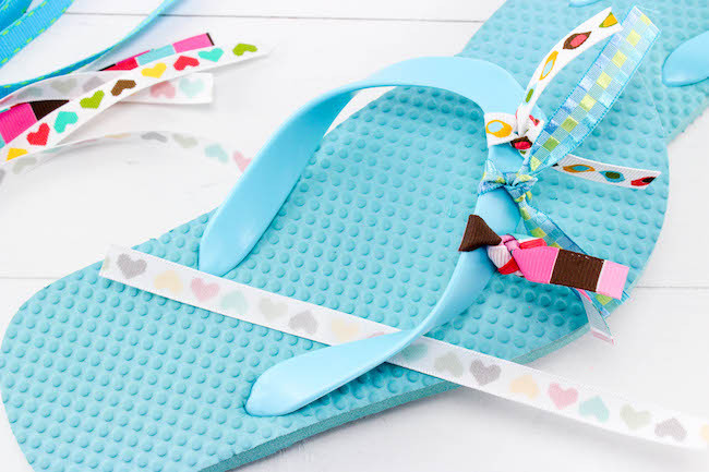 With today being National Flip Flops Day, nothing is more fitting than a DIY Ribbon Flip Flops Craft. Keep the kids busy when they are stuck inside!