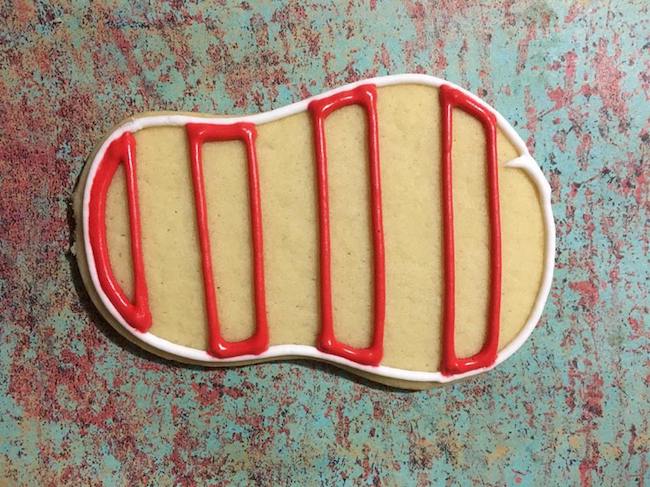Red stripes on flip flop sugar cookie