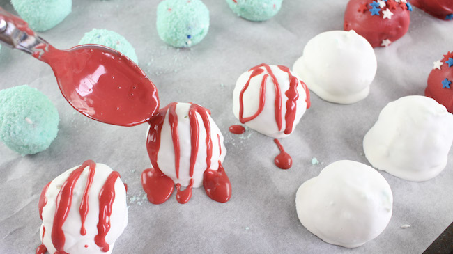 Drizzle melted candy on cake batter truffle