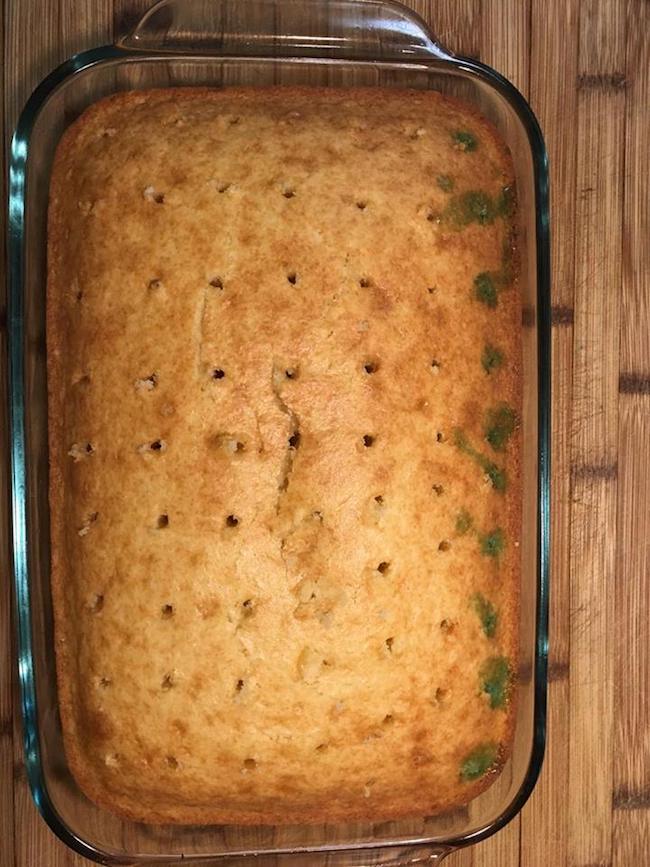 Poke cake with holes in it.