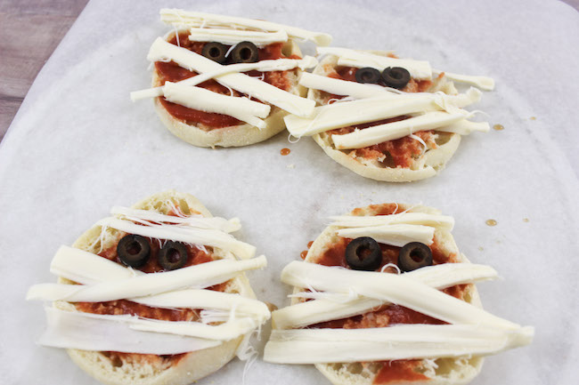 We just shared the Halloween Mummy Meatball recipe and today we have the Mummy Pizza recipe. It's super easy to make too.