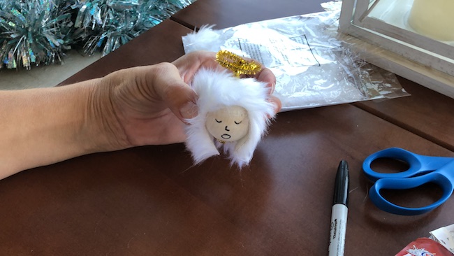 I can use the Milk Jug Angel on my table as a decoration on top of a flameless candle and the light shines through or as a tree top decoration.