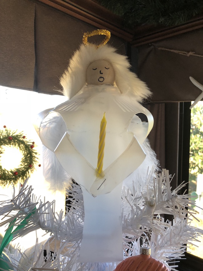 I can use the Milk Jug Angel on my table as a decoration on top of a flameless candle and the light shines through or as a tree top decoration.