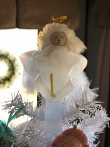 I can use the Milk Jug Angel on my table as a decoration on top of a flameless candle and the light shines through or as a tree top decoration.
