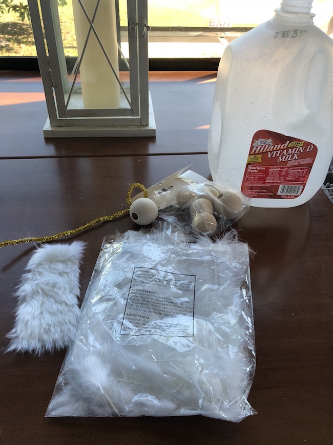 I can use the Milk Jug Angel on my table as a decoration on top of a flameless candle and the light shines through or as a tree top decoration.