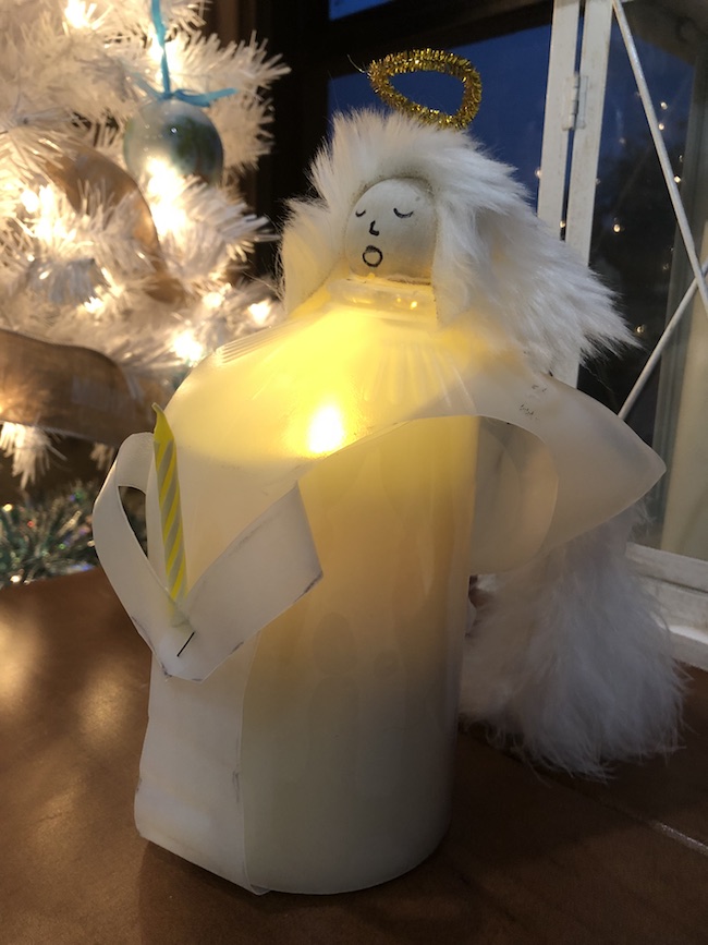 I can use the Milk Jug Angel on my table as a decoration on top of a flameless candle and the light shines through or as a tree top decoration.
