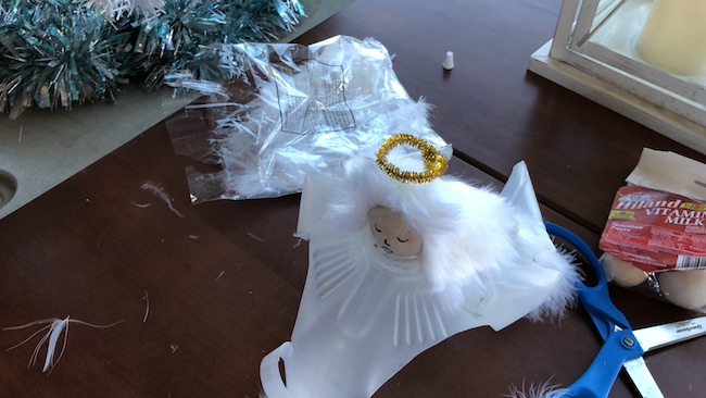 I can use the Milk Jug Angel on my table as a decoration on top of a flameless candle and the light shines through or as a tree top decoration.