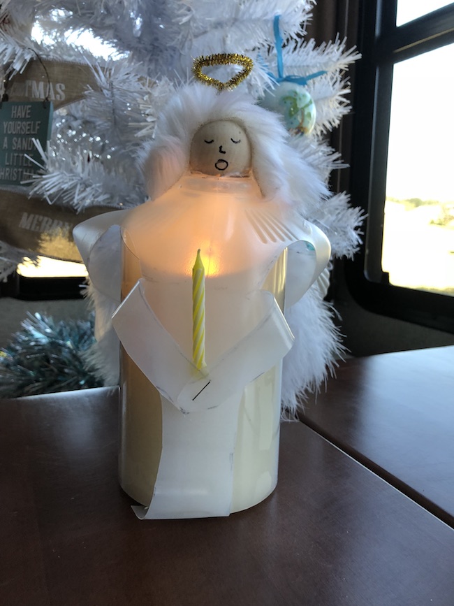 I can use the Milk Jug Angel on my table as a decoration on top of a flameless candle and the light shines through or as a tree top decoration.