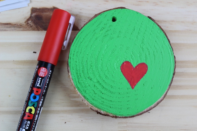 Grinch ornament with a heart