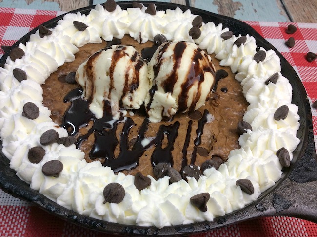At home or camping, the Cast Iron Skillet Triple Chocolate Hot Fudge Brownie Recipe is a recipe that you can use no matter where you are. 