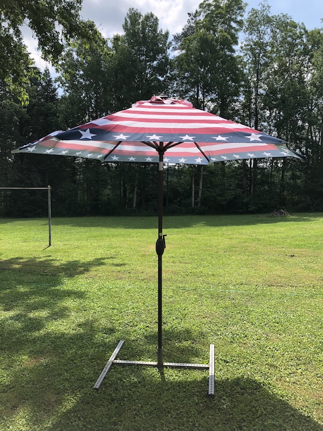 The Outdoor Patio Umbrella made by Abba Patio and is 9 feet in diameter where you can fit your 42 - 54 inch table under with 4 to 6 chairs.