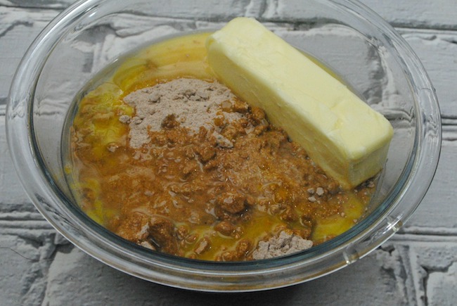 Preheat your oven to 350 degrees. Line your cookie sheet with parchment paper. Sift the flour, baking soda, cinnamon, ginger, allspice, cloves, salt into a bowl. Set aside. Next using an electric mixer on high, beat the butter and vegetable shortening until blended, about 1 minute. Add the brown sugar, a tablespoon at a time then beat the mixture for about 2 minutes. Continue to beat while adding in the molasses and the egg. Using a wooden spoon at first, slowly mix in the flour mixture then work the dough together with your hands. Add the dried cranberries and chocolate chips. Mix well. Make the dough into a large ball then cover it with cling wrap. Place the bowl of dough into the refrigerator until chilled. (About 3 hours). Remove the dough from the refrigerator and let stand at room temperature until just warm enough to make into round balls the size of a teaspoon. Bake at 350 degrees for 10 to 12 minutes. Remove from the oven allowing the cookies to cool and sprinkle each cookie with powder sugar. Enjoy!