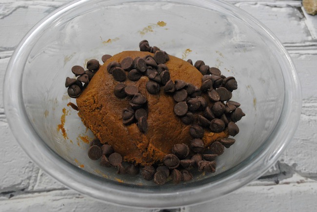 Preheat your oven to 350 degrees. Line your cookie sheet with parchment paper. Sift the flour, baking soda, cinnamon, ginger, allspice, cloves, salt into a bowl. Set aside. Next using an electric mixer on high, beat the butter and vegetable shortening until blended, about 1 minute. Add the brown sugar, a tablespoon at a time then beat the mixture for about 2 minutes. Continue to beat while adding in the molasses and the egg. Using a wooden spoon at first, slowly mix in the flour mixture then work the dough together with your hands. Add the dried cranberries and chocolate chips. Mix well. Make the dough into a large ball then cover it with cling wrap. Place the bowl of dough into the refrigerator until chilled. (About 3 hours). Remove the dough from the refrigerator and let stand at room temperature until just warm enough to make into round balls the size of a teaspoon. Bake at 350 degrees for 10 to 12 minutes. Remove from the oven allowing the cookies to cool and sprinkle each cookie with powder sugar. Enjoy!